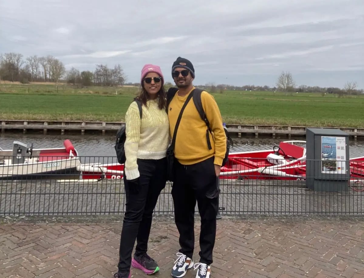 Sanket and Krina posing in Giethoorn in the Netherlands