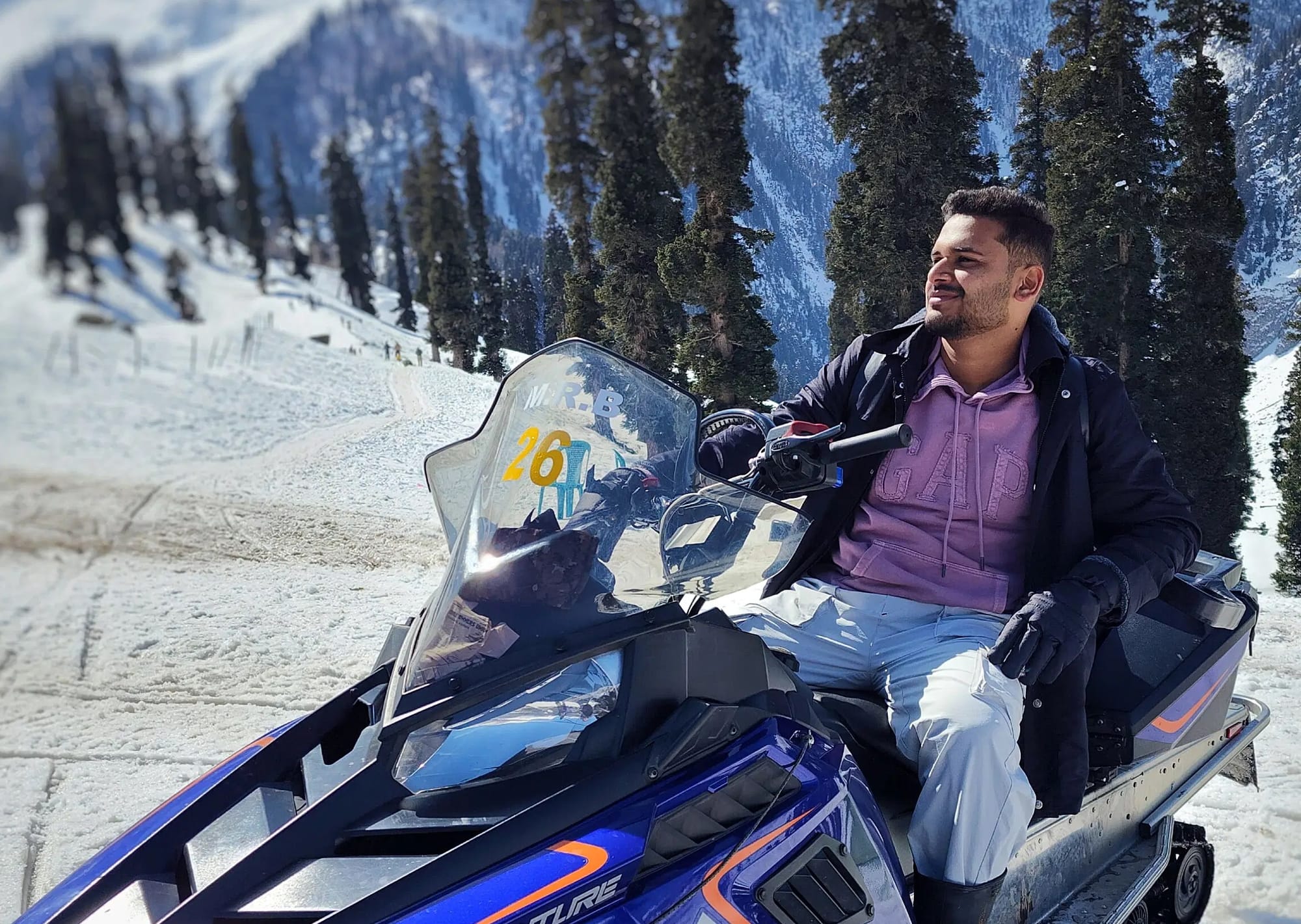 Man hiding a snowmobile in Gulmarg
