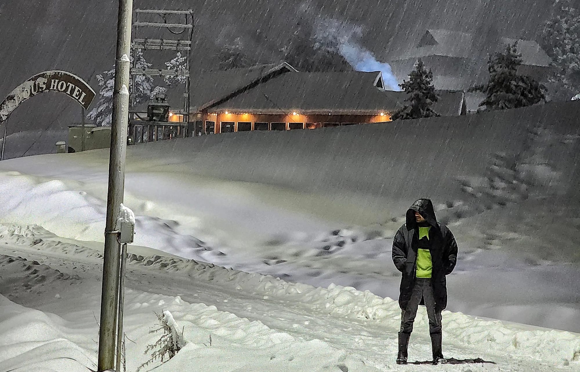 Man standing in snow covered lands in Kashmir