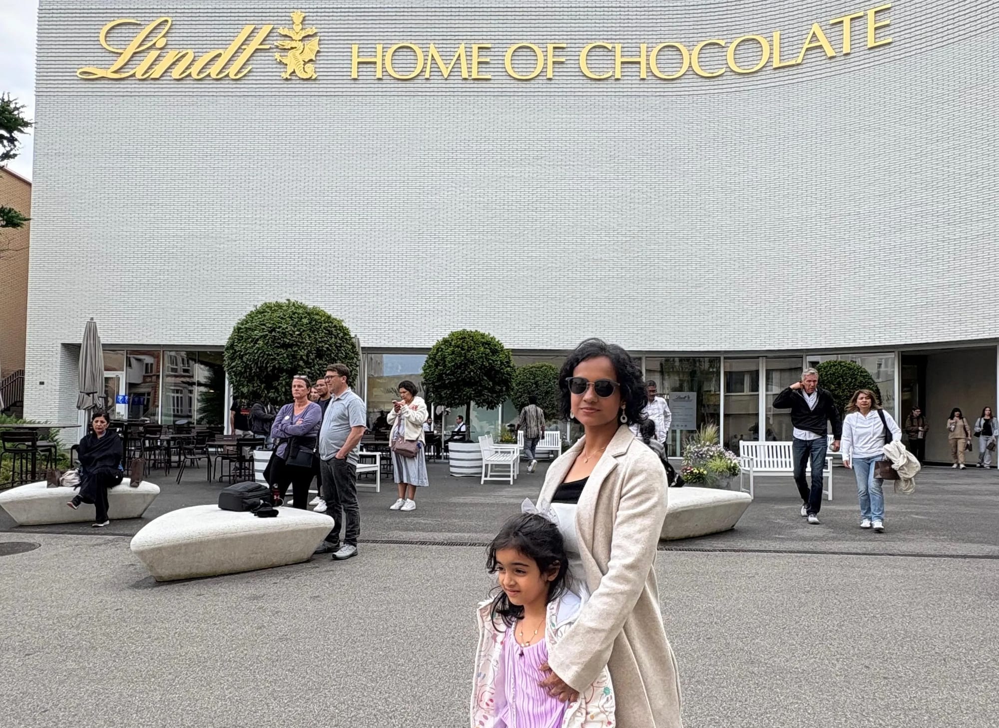 Pankhuri and Syona posing in front of Home of Chocolate, Zurich