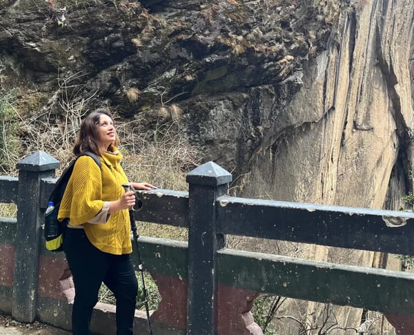 Disha trekking to Tiger’s Nest Monastery during her solo Bhutan trip with Thrillophilia.